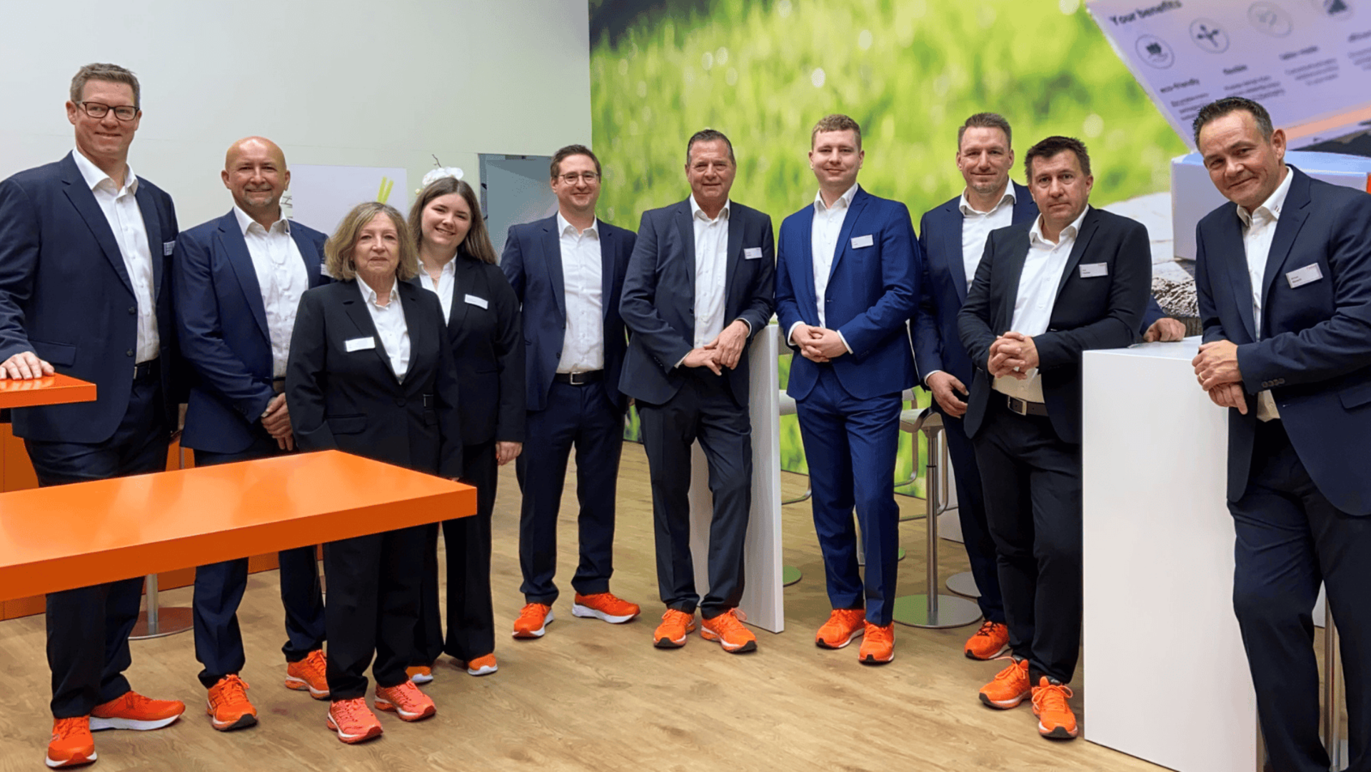 Shall we meet at CPhI in Frankfurt? 28 - 30 October 2025 Faller Packaging team at CPhI in Frankfurt in Hall 8, Stand 8.0M34. The team members wear elegant business attire with distinctive orange sneakers and welcome visitors at the modern exhibition stand. Meet our packaging experts and learn more about innovative pharmaceutical packaging solutions.